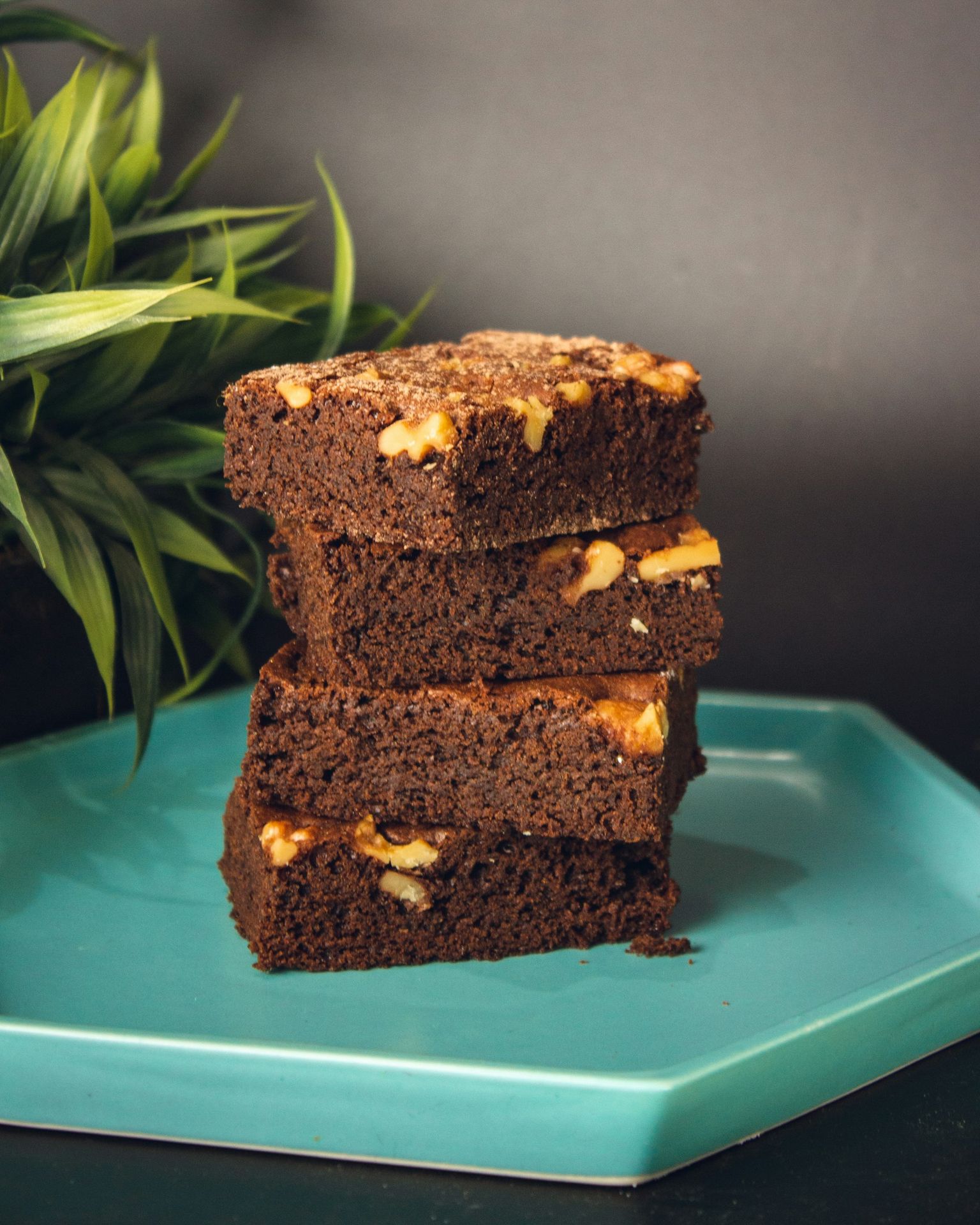 a brown cake with white frosting